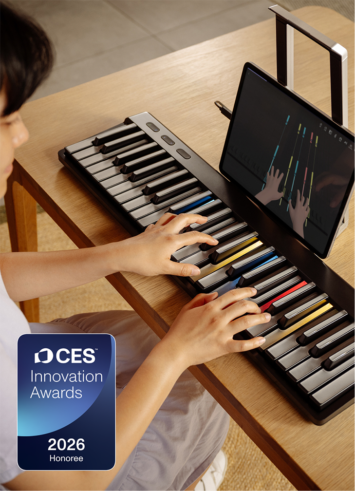 A person playing a ROLI Piano on a wooden desk, with a tablet displaying a piano learning app and a CES Innovation Awards 2026 Honoree badge in the corner.