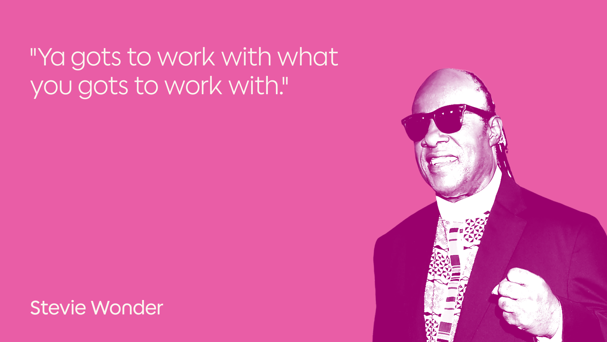 A stylized image of a smiling man in sunglasses and a suit, set against a pink background with the quote "Ya gots to work with what you gots to work with." and the name Stevie Wonder in white text.